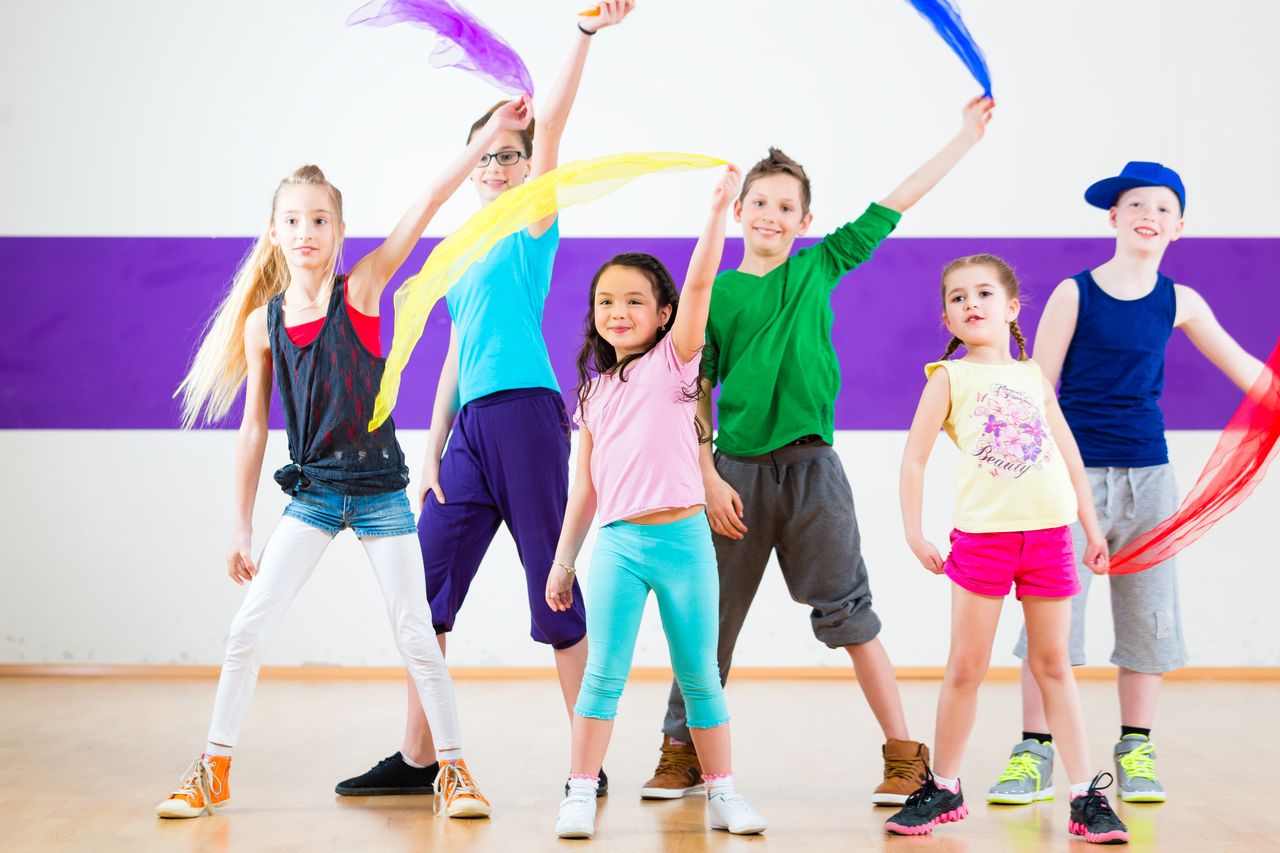 Kids in dancing class traninng with scarfs