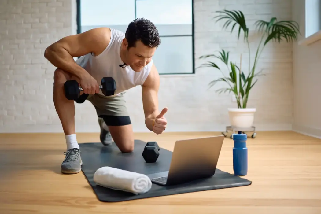 Man Using Dumbbells Doing A Home Workout 2026 01 09 10 08 39 Utc