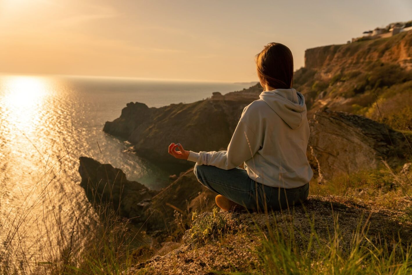 young-tourist-woman-enjoying-sunset-sea-mountain-landscape-while-sitting-outdoor-womens-yoga